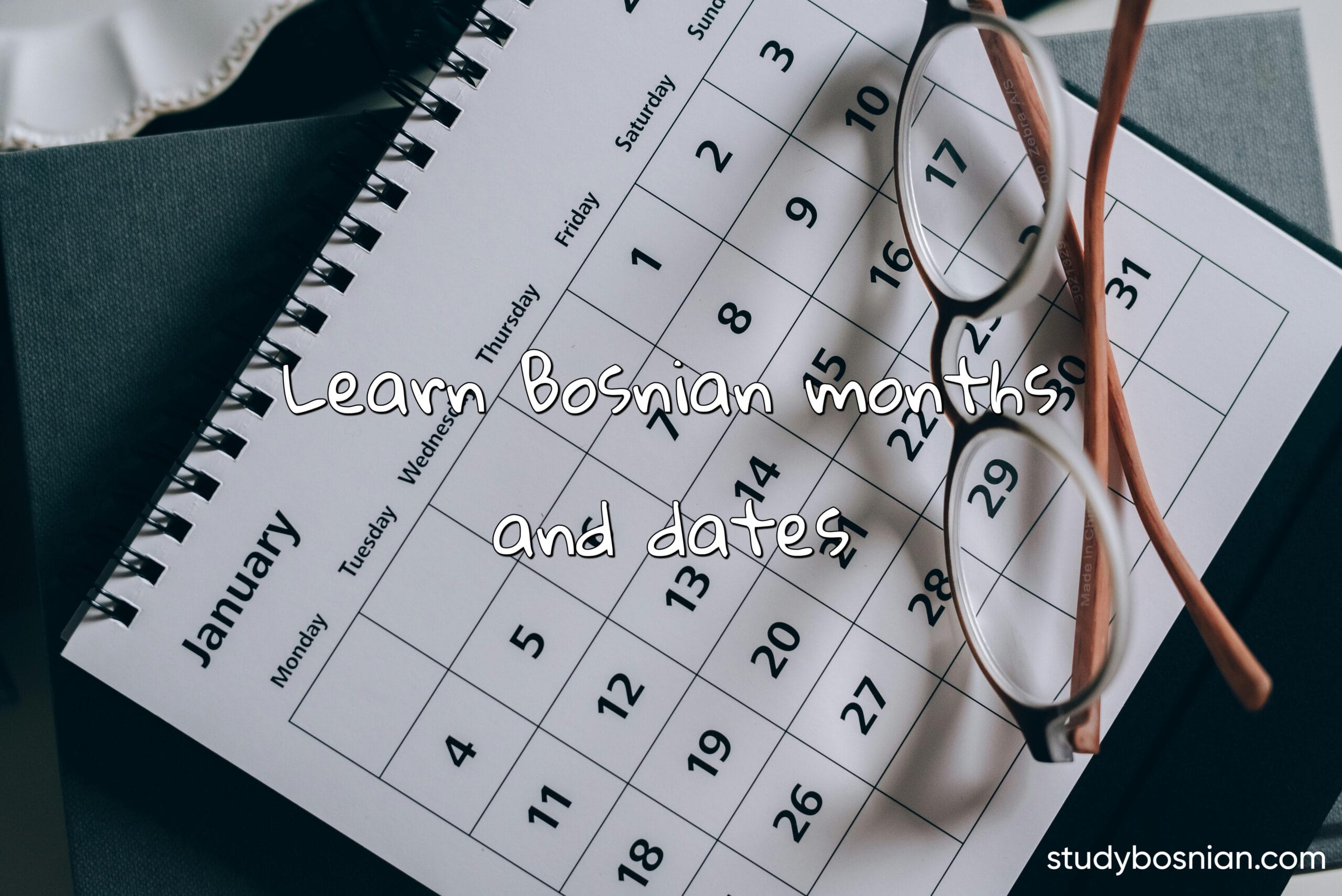 learn how to say the months in Bosnian, a picture with a calendar and glasses.